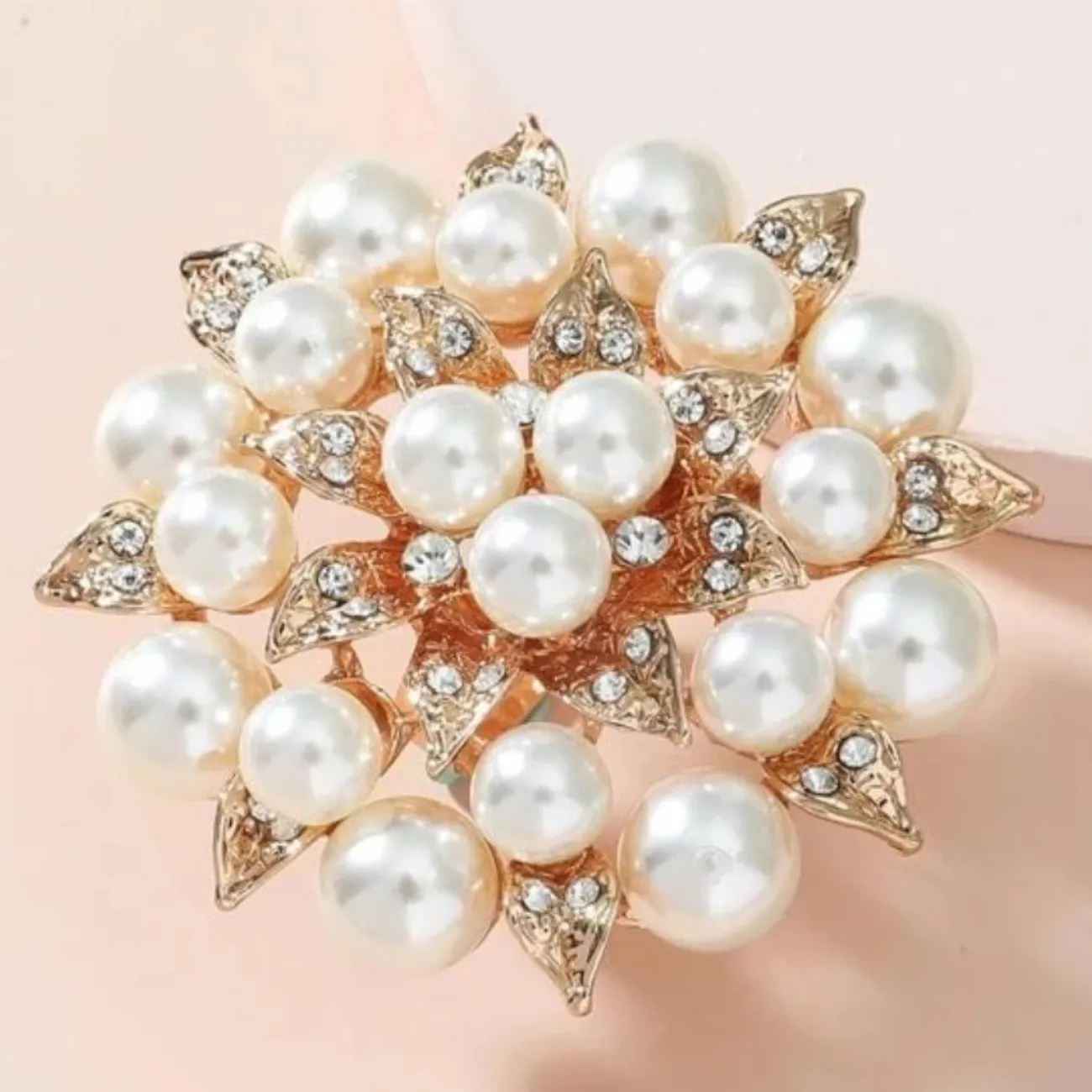 Faux pearl and rhinestone flower ring.