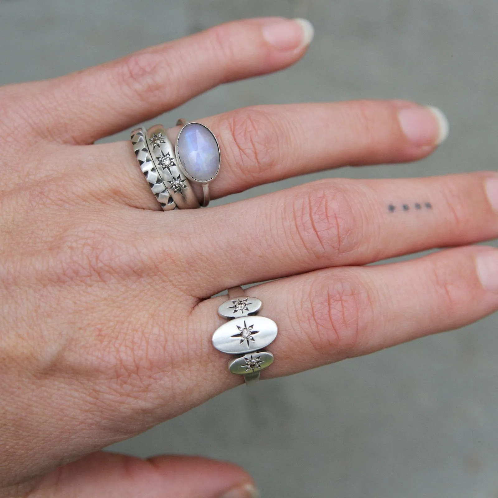 Three Ovals with Star Set CZ Ring